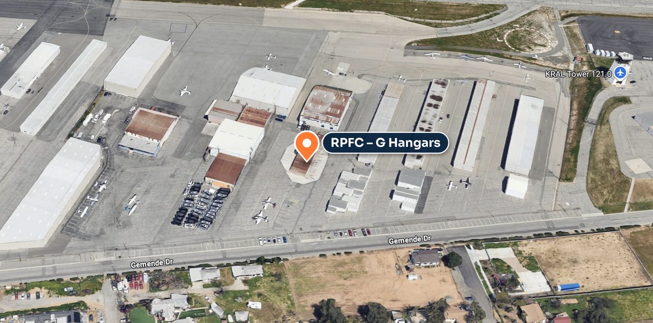 Aerial view of Riverside Municipal Airport showing the RPFC G Hangars off Gemende Dr, with the KRAL tower